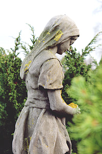 selective focus photography of woman wearing dress statue thumbnail