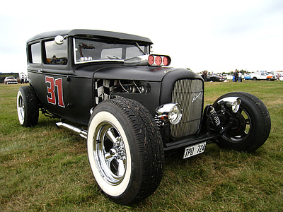 vintage black hot rod on grassland thumbnail