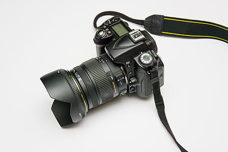 Black Dslr Camera on White Surface thumbnail