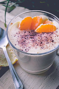 glass cup filled with beverage with orange toppings thumbnail