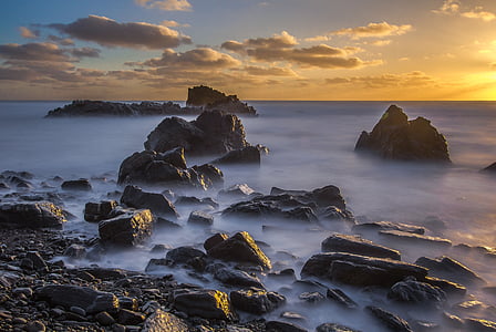 rock formation in body of water thumbnail