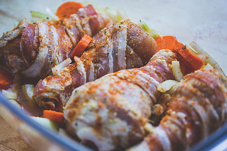 four breaded chicken legs with vegetables in selective focus photography thumbnail