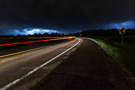 photo of road during cloudy sky thumbnail