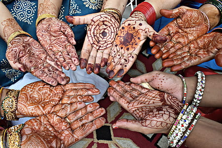 flat-lay photography of people with mehndi thumbnail