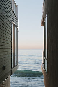 seawaves splashing house near shore thumbnail