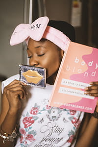Woman Holding Two Cosmetic Product Boxes thumbnail