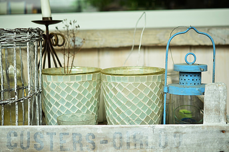 two gray and white glass vase and blue metal candle lantern thumbnail