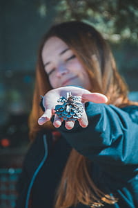 woman holding pine cone thumbnail