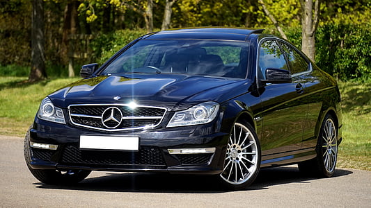 black Mercedes-Benz coupe on road during daytime thumbnail