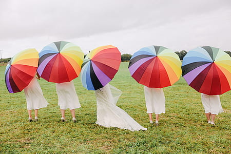 group of people holding multicolored umbrellas thumbnail