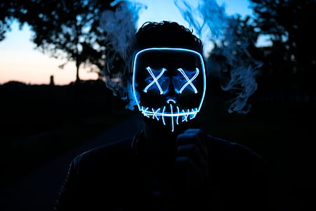 neon light mask on person's face thumbnail