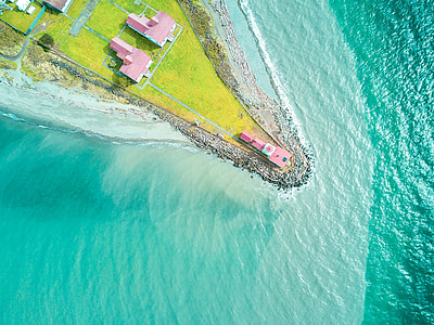 small village beside of body of water thumbnail