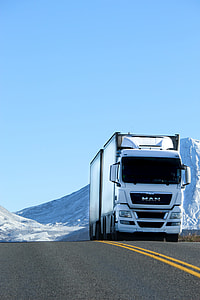 white Man trailer truck photography during daytime thumbnail