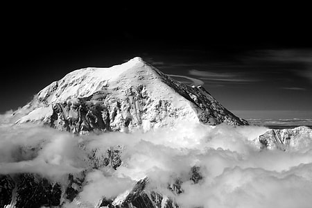 grayscale photography of mountains covered with snow thumbnail
