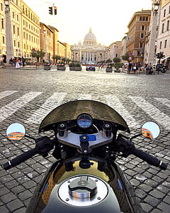 Black Motorcycle in Front of Pedestrian Lane With Orange Traffic Light thumbnail