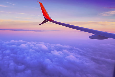 white and red plane wing view thumbnail