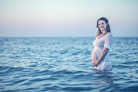 woman with white dress on water thumbnail