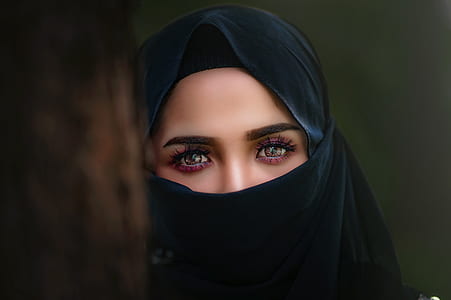 woman in black hiqab viel in shallow focus photography thumbnail