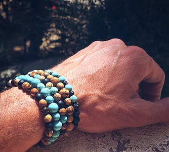 person's hand wearing bracelet thumbnail