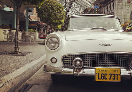 vintage gray car near green tree thumbnail