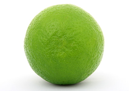 selective focus photography of green lime on white surface thumbnail