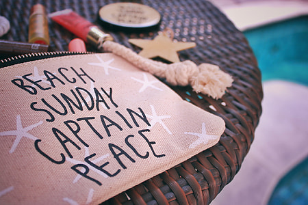 beige and black Beach Sunday Captain Peace print wallet thumbnail