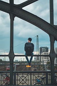 person sitting on metal bar thumbnail