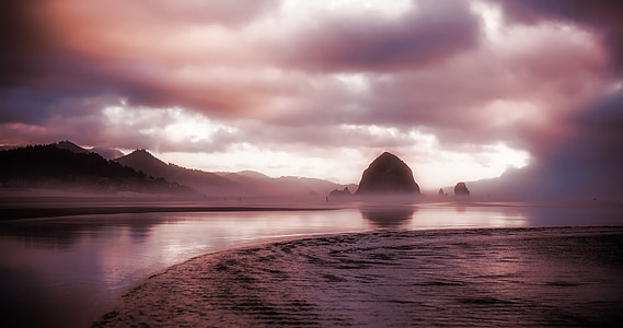 body of water under cloudy sky thumbnail
