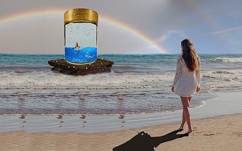 woman in white dress walking toward sea thumbnail
