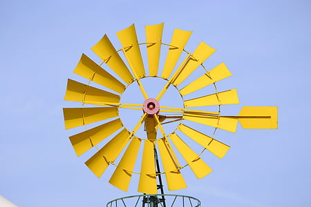 yellow windmill under clear skies thumbnail