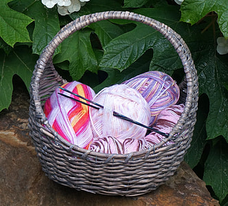pink yarn rolls on basket thumbnail