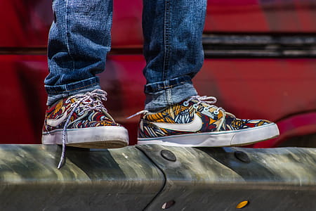 Pair of Yellow-and-red Nike Low-top Sneakers thumbnail