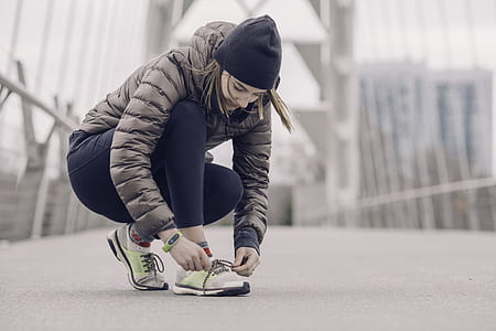 woman lacing shoe thumbnail