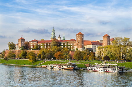 boats parked near castle thumbnail