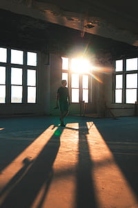 man standing on brown concrete floor thumbnail