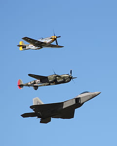 three aircraft flying under blue sky during daytime thumbnail