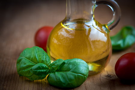 clear glass oil bottle and green leaf thumbnail