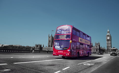 red double-decker bus on road thumbnail