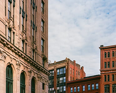 brown painted building under white sky thumbnail