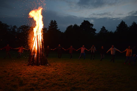 group of person standing in front of bonfire thumbnail