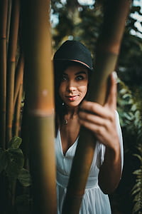 woman hiding on bamboo trees thumbnail
