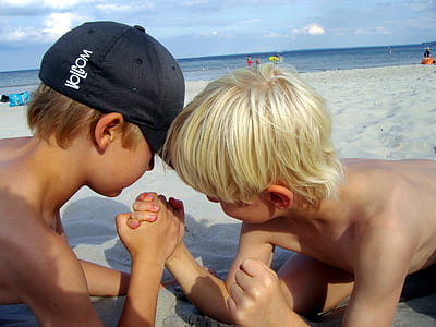 two boys playing at the beach thumbnail