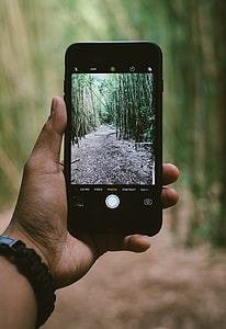 jet black iPhone 7 person holding taking picture thumbnail