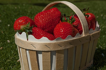 bunch of strawberry on brown basket thumbnail