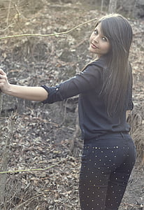 woman wearing black long-sleeved shirt with black and white polka bottoms thumbnail