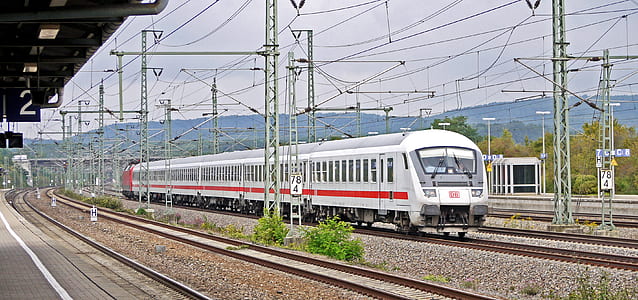white red train in train station thumbnail