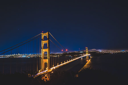 Golden bridge during nigh time photography thumbnail