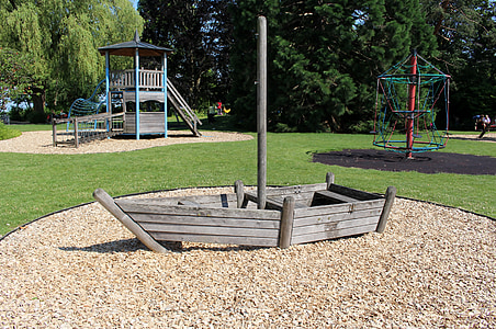 gray wooden boat in park thumbnail