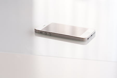 iPhone 5s on white surface thumbnail