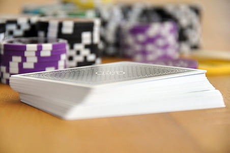 playing cards beside chips on table thumbnail